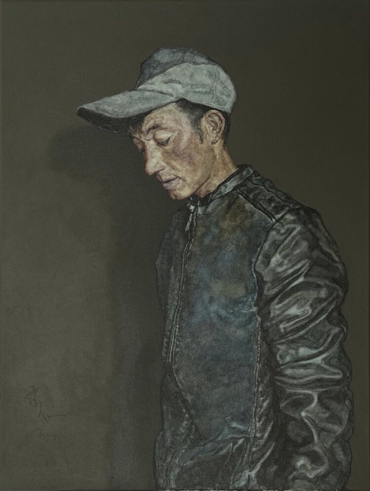 戴帽子的塔族青年